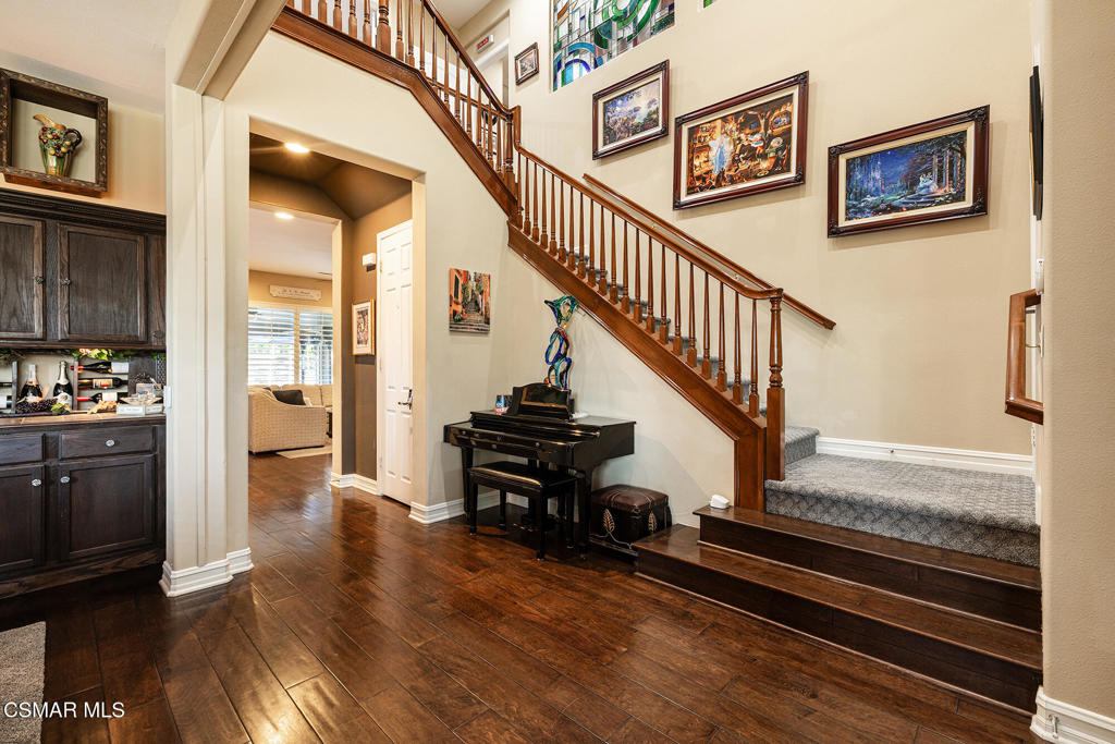 5019 Corral Street Simi Valley, CA 93063 - Photo 6 of 50 a view of a hallway with wooden floor and staircase