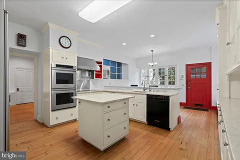 a view of pathway with an outdoor seating