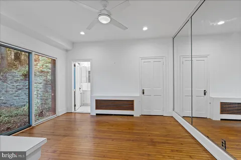 a view of a backyard with large trees
