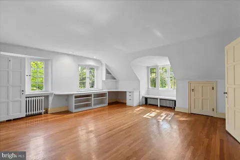 a bathroom with a bathtub a sink and a mirror