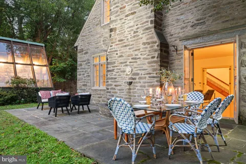 a backyard of a house with outdoor seating