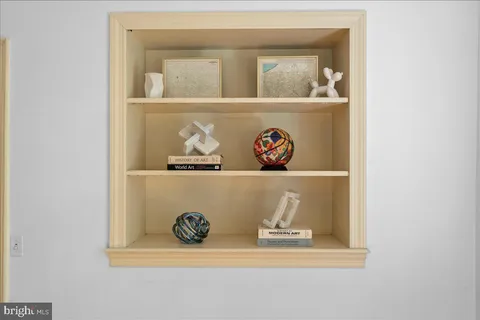 a living room with furniture two window and a fireplace