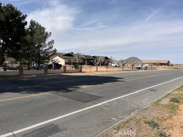 7 Navajo Road Apple Valley, CA 92308 - Photo 1 of 1 a view of street with view of residential houses