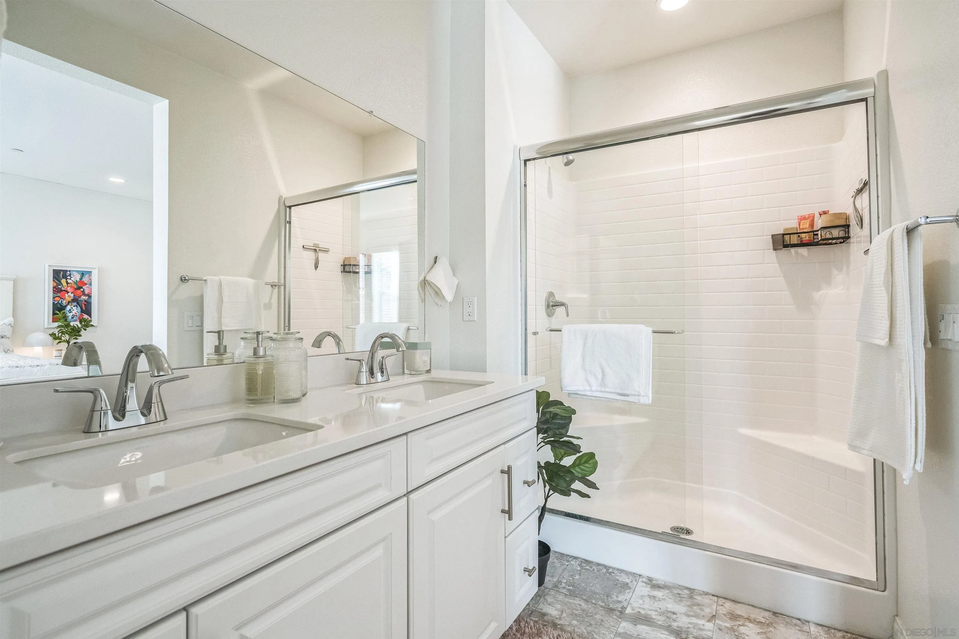 2018 Barite Street Spring Valley, CA 91977 - Photo 31 of 47 a bathroom with a double vanity sink and a shower