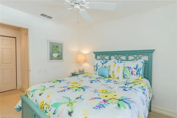 a bedroom with a bed and a table