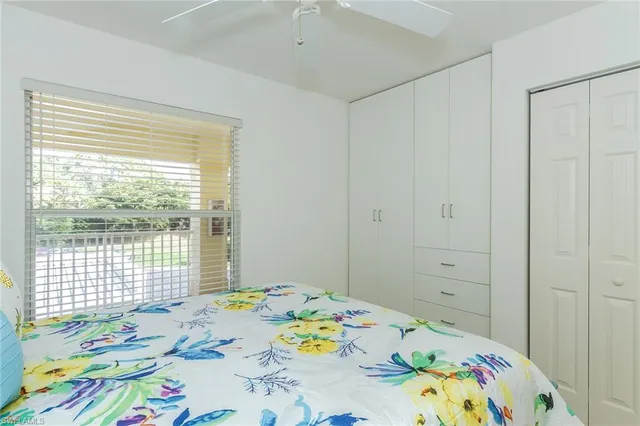 a bedroom that has a bed and a dresser in it