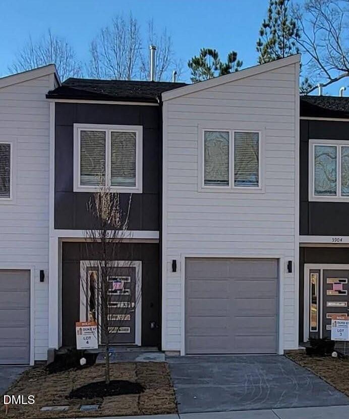 4201 Convergence Street Durham, NC 27704 - Photo 1 of 35 a front view of a house with glass windows