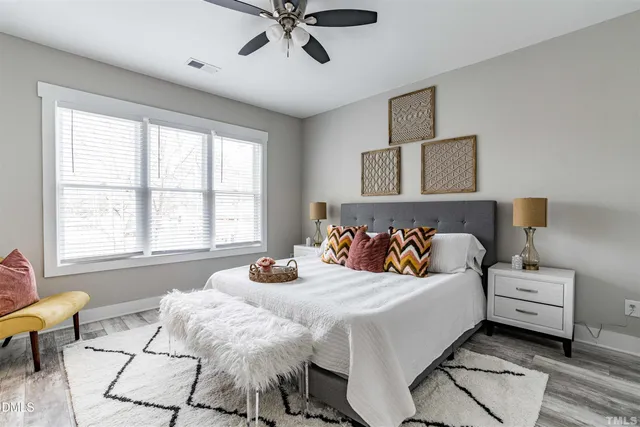 a bedroom with a bed and window