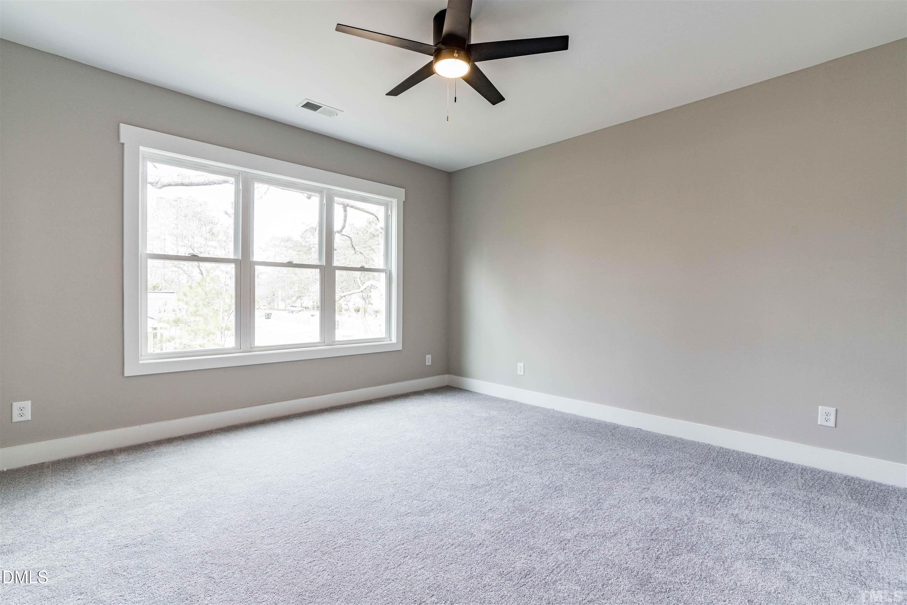 4201 Convergence Street Durham, NC 27704 - Photo 21 of 35 a view of a room with windows and chandelier fan