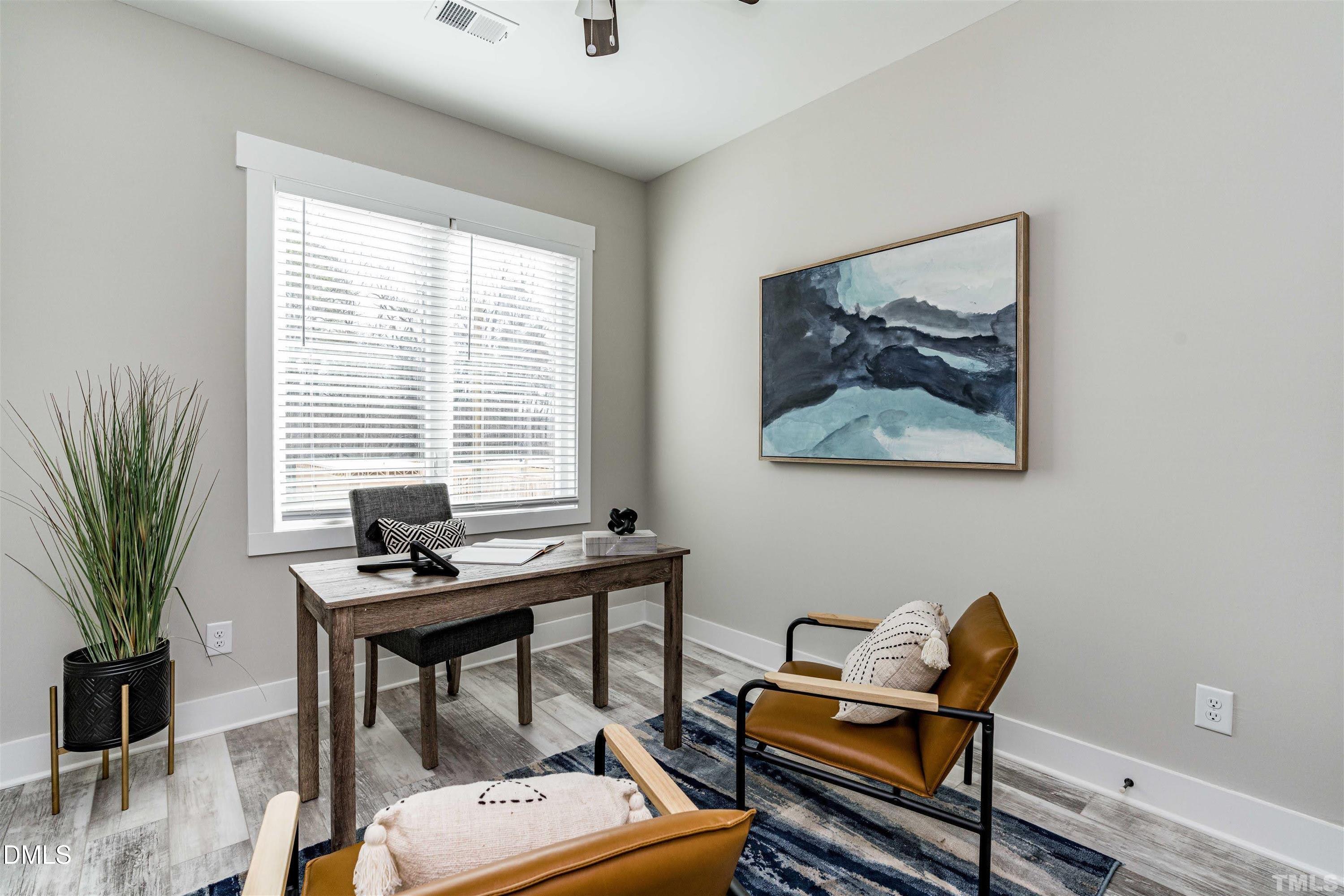 4201 Convergence Street Durham, NC 27704 - Photo 24 of 35 a view of a workspace with furniture and a window