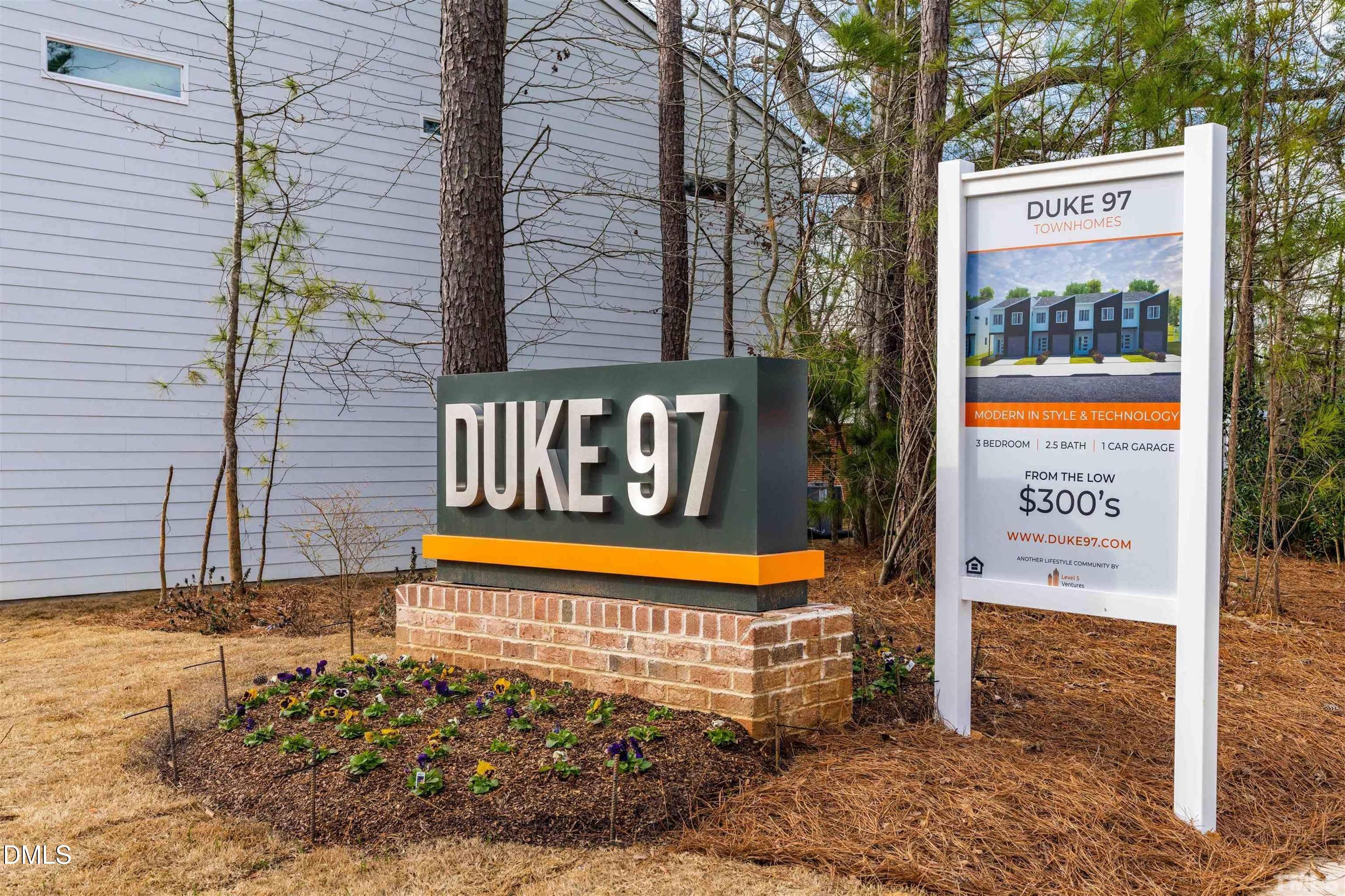 4201 Convergence Street Durham, NC 27704 - Photo 31 of 35 a sign on the side of a building