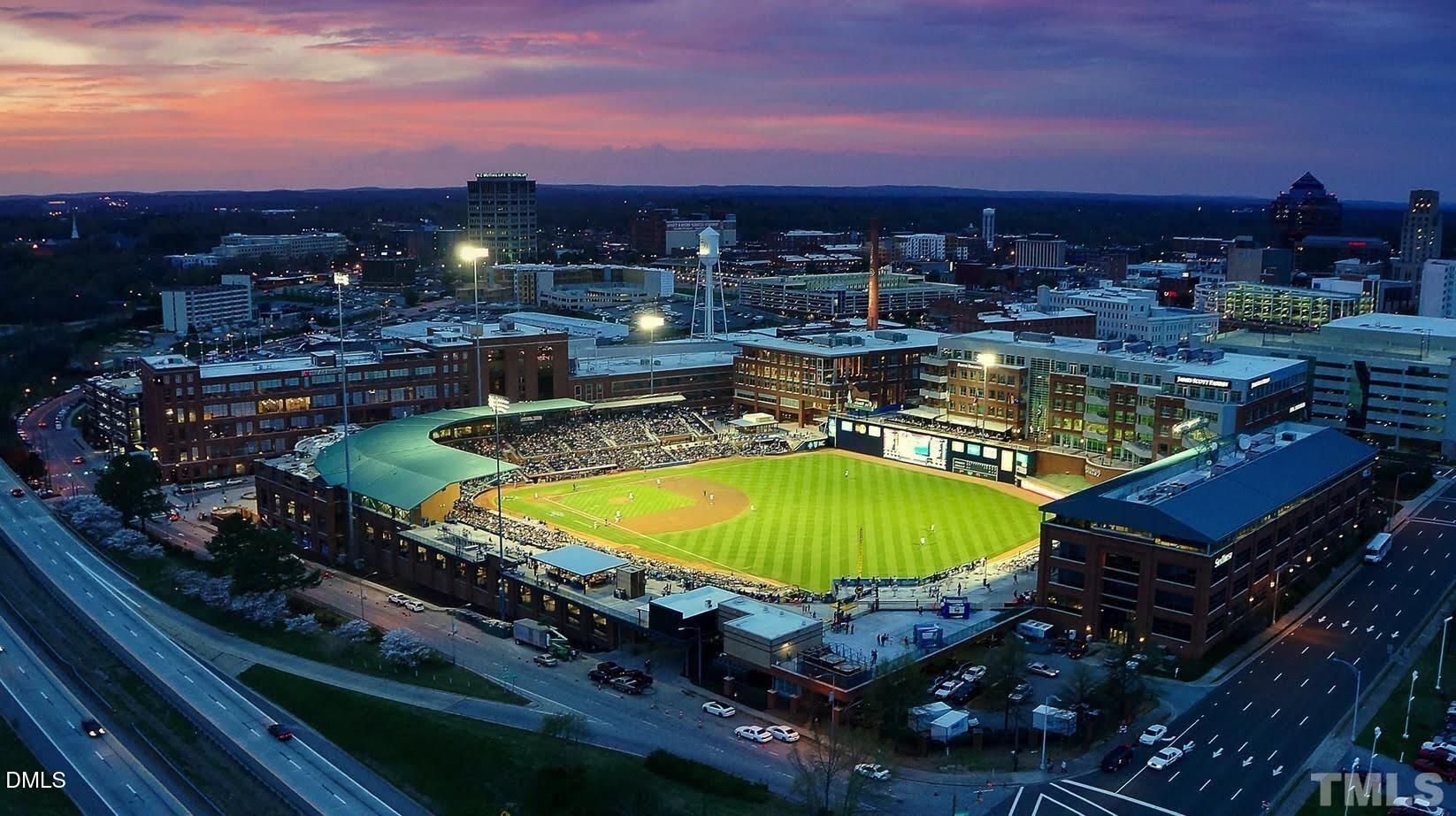 4201 Convergence Street Durham, NC 27704 - Photo 35 of 35 a view of a swimming pool with lawn chairs under an umbrella