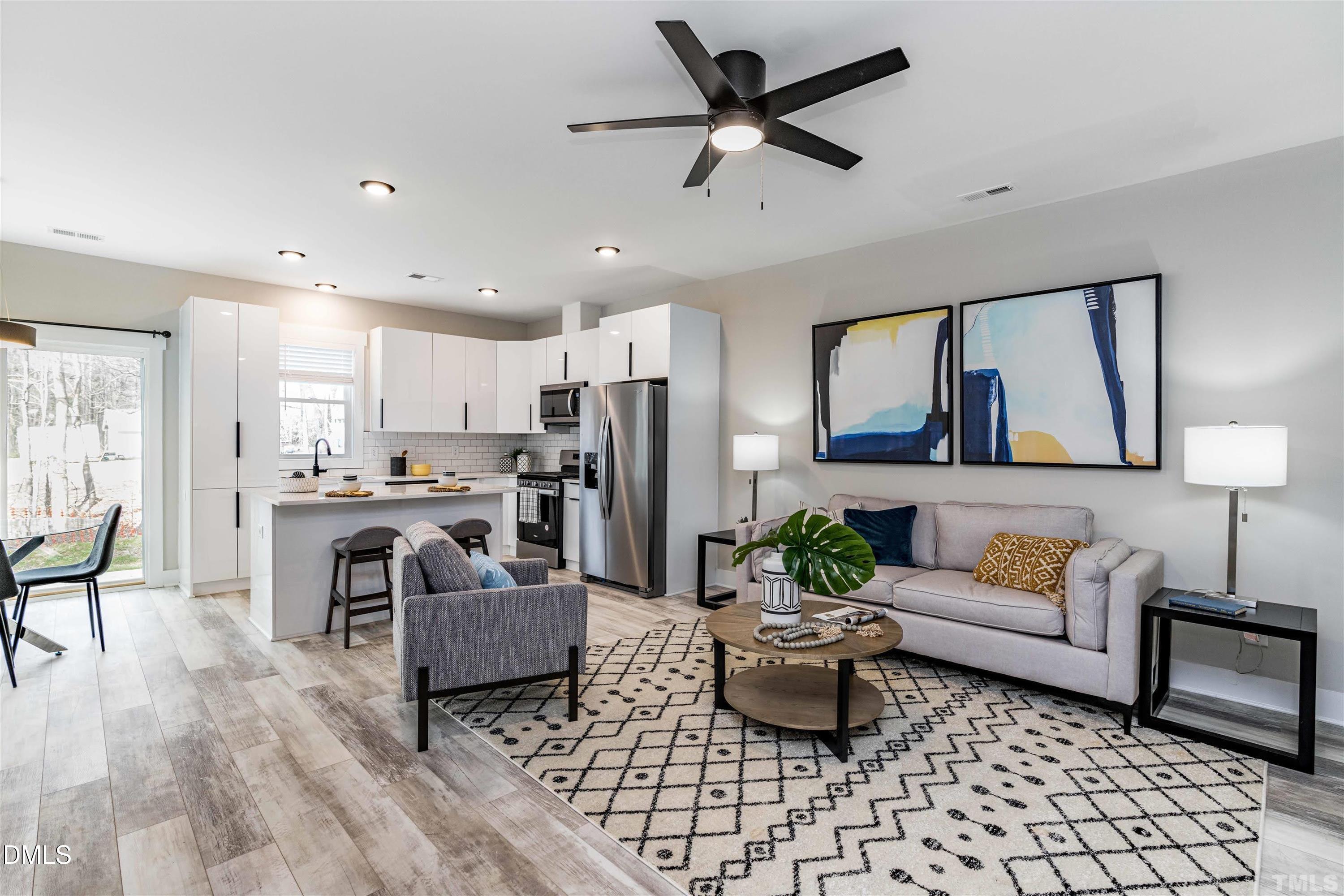 4201 Convergence Street Durham, NC 27704 - Photo 5 of 35 a living room with furniture and kitchen view