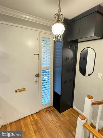 a bedroom with a bed and a mirror