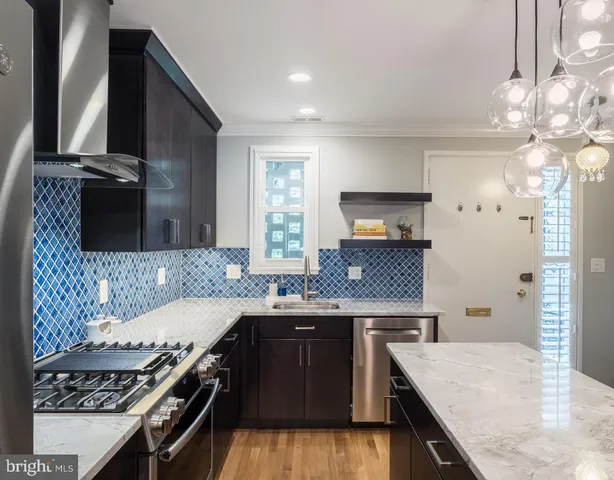 a kitchen with a stove and a sink