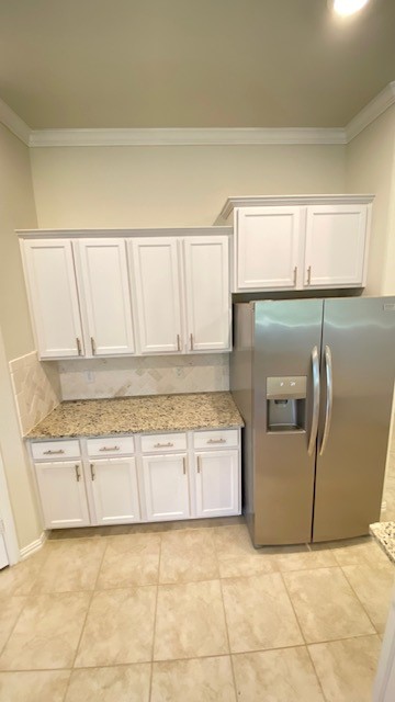 5002 Naples Grove Lane Rosharon, TX 77583 - Photo 6 of 38 Modern kitchen featuring sleek stainless steel appliances, elegant white cabinetry, and polished granite countertops for a sophisticated touch.
