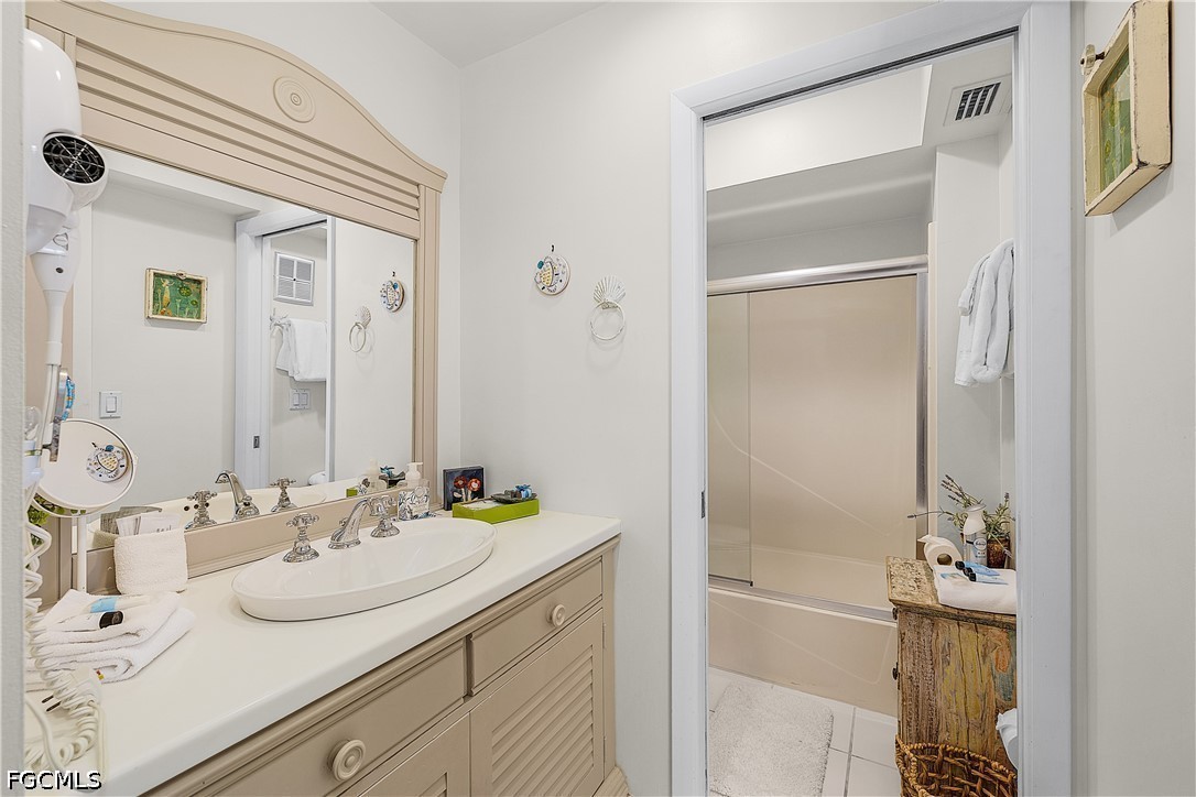 515 Useppa Useppa Island Bokeelia, FL 33922 - Photo 24 of 43 a bathroom with a sink and a mirror