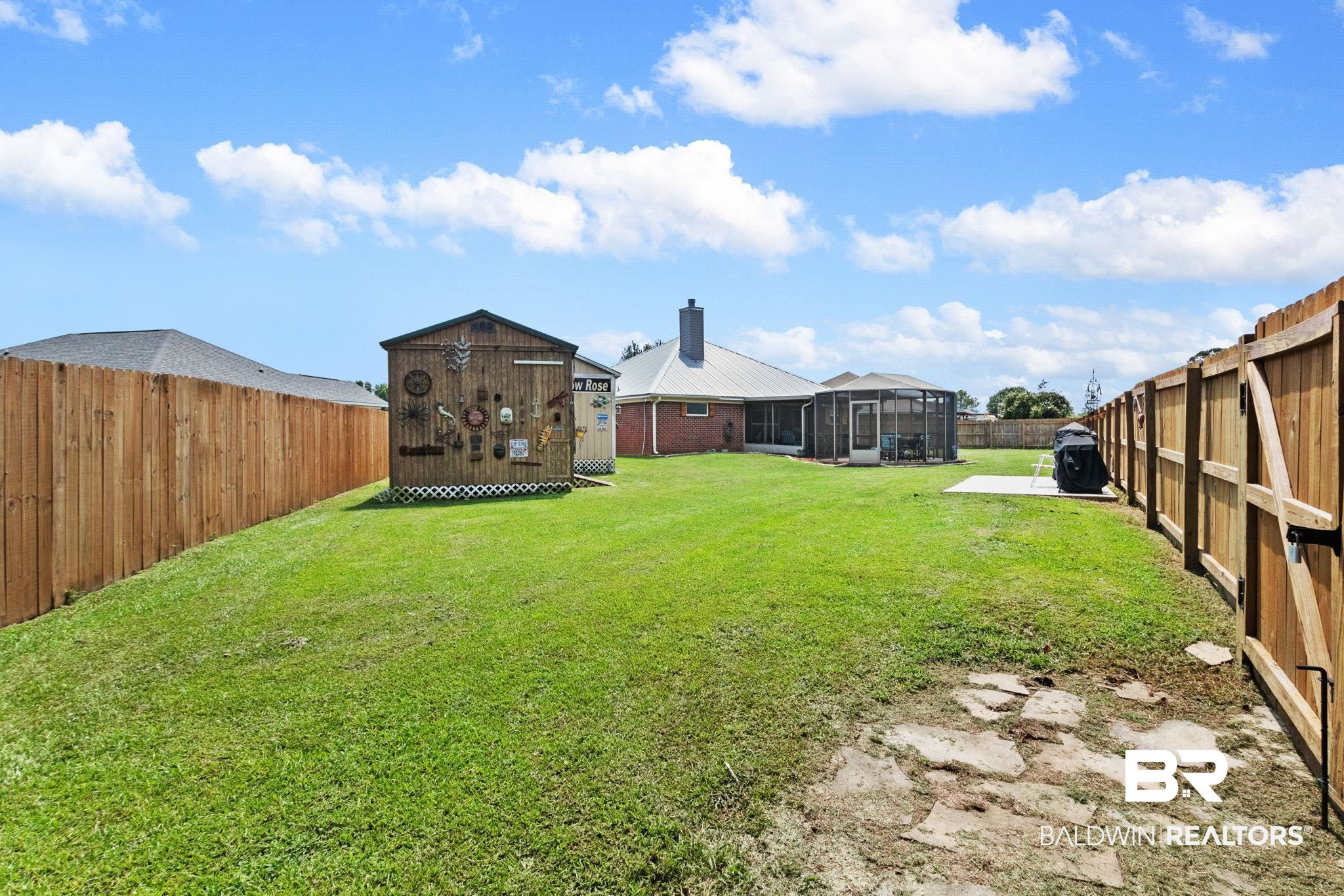 16898 Sugar Loop Foley, AL 36535 - Photo 62 of 67 View of yard featuring a storage unit