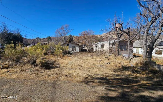 a view of a house with a snow in the background