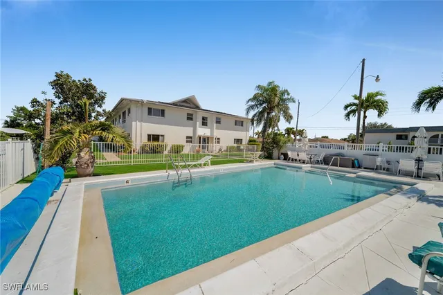 a view of a park with large trees