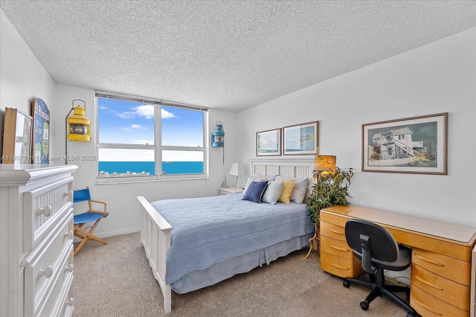 90 Alton Road, Unit 2911 Miami Beach, FL 33139 - Photo 21 of 39 a bedroom with a bed and a desk