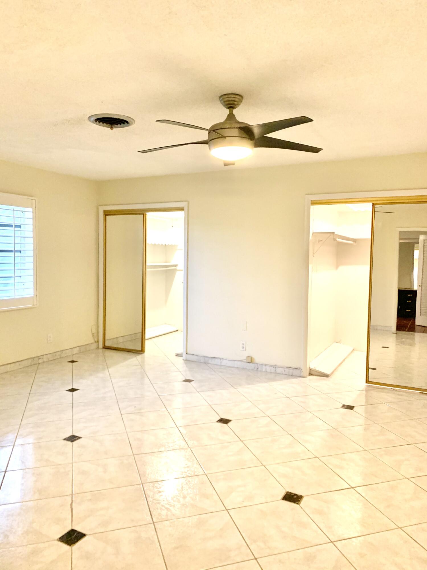 2735 Northeast 28th Court Lighthouse Point, FL 33064 - Photo 14 of 28 a view of an empty room with a window
