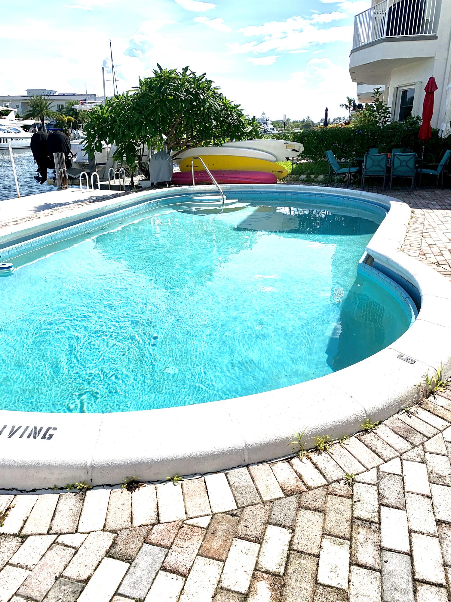 2735 Northeast 28th Court Lighthouse Point, FL 33064 - Photo 23 of 28 a view of swimming pool from a lake view