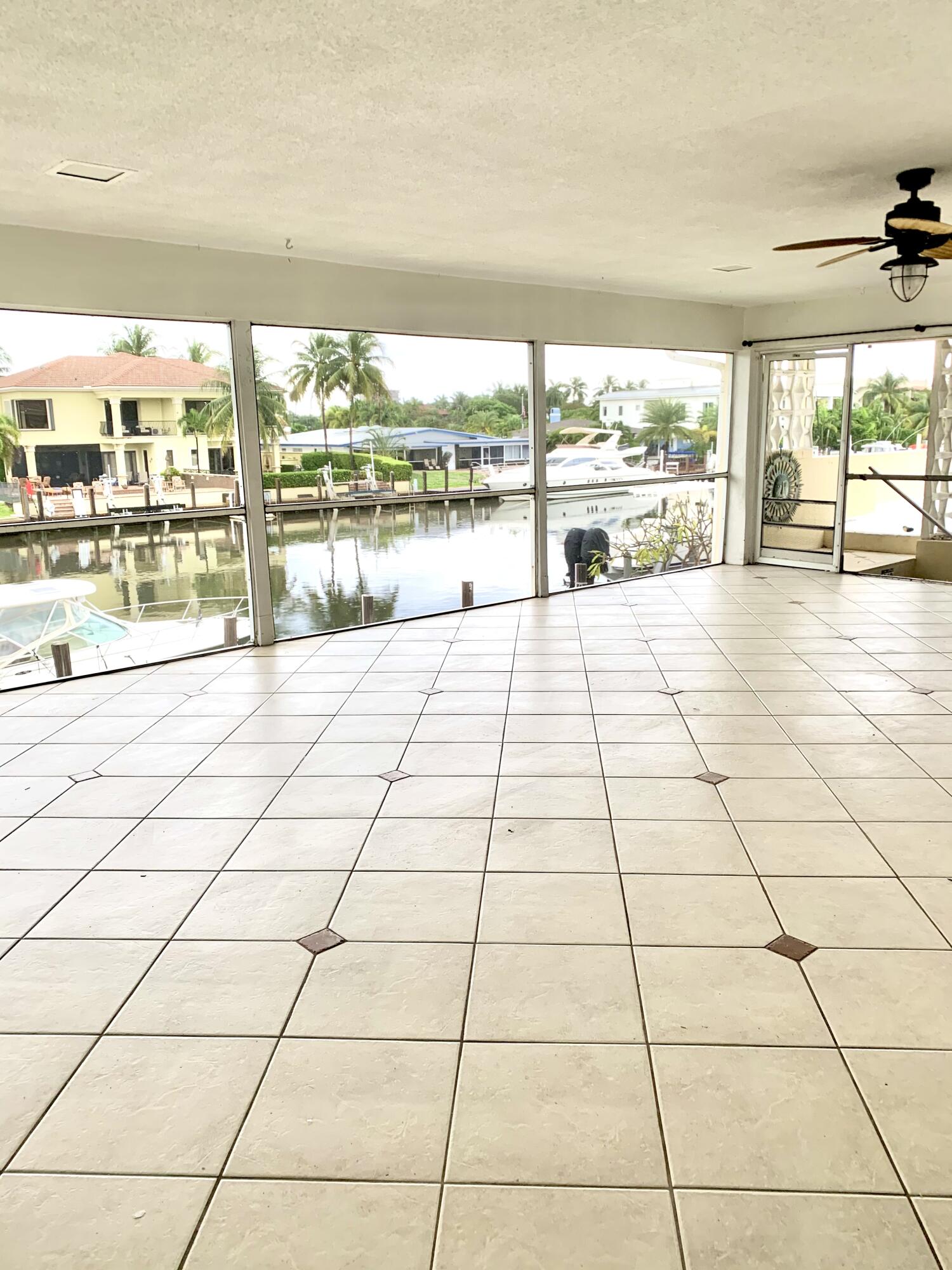 2735 Northeast 28th Court Lighthouse Point, FL 33064 - Photo 24 of 28 a room with a large window