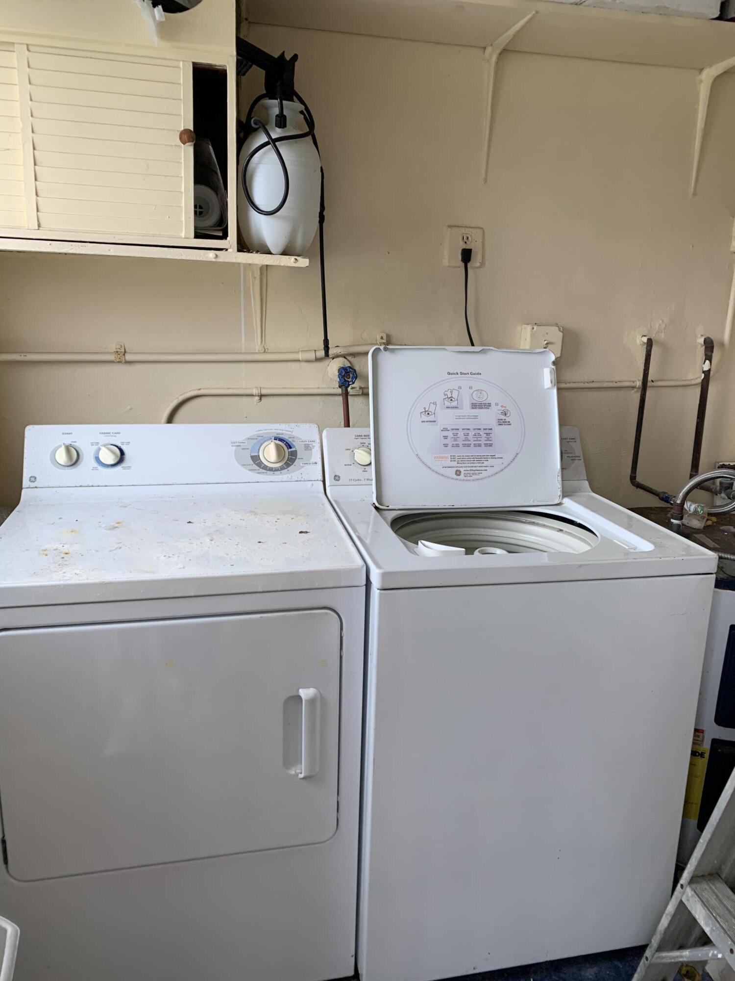 2735 Northeast 28th Court Lighthouse Point, FL 33064 - Photo 25 of 28 a utility room with dryer and washer