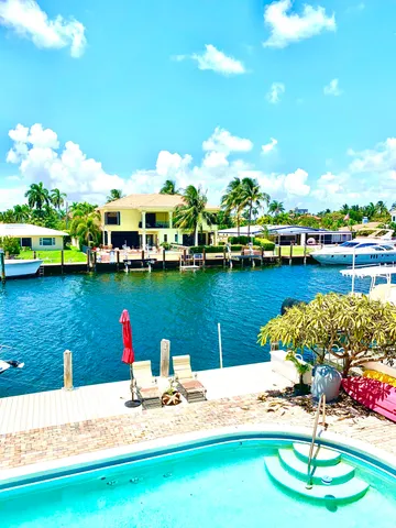 a view of a lake with couches and city view