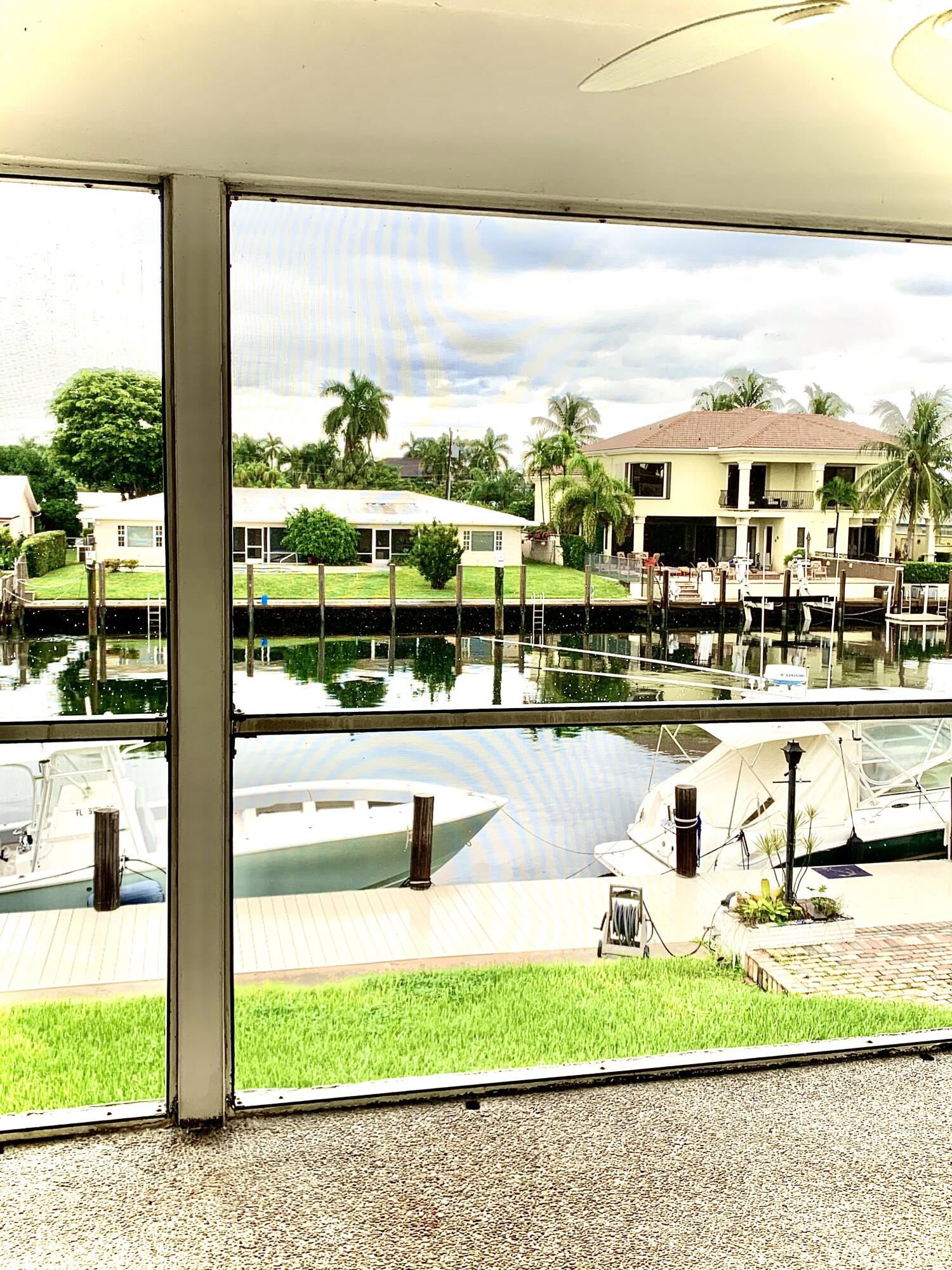 2735 Northeast 28th Court Lighthouse Point, FL 33064 - Photo 6 of 28 a view of swimming pool with outdoor seating and plants