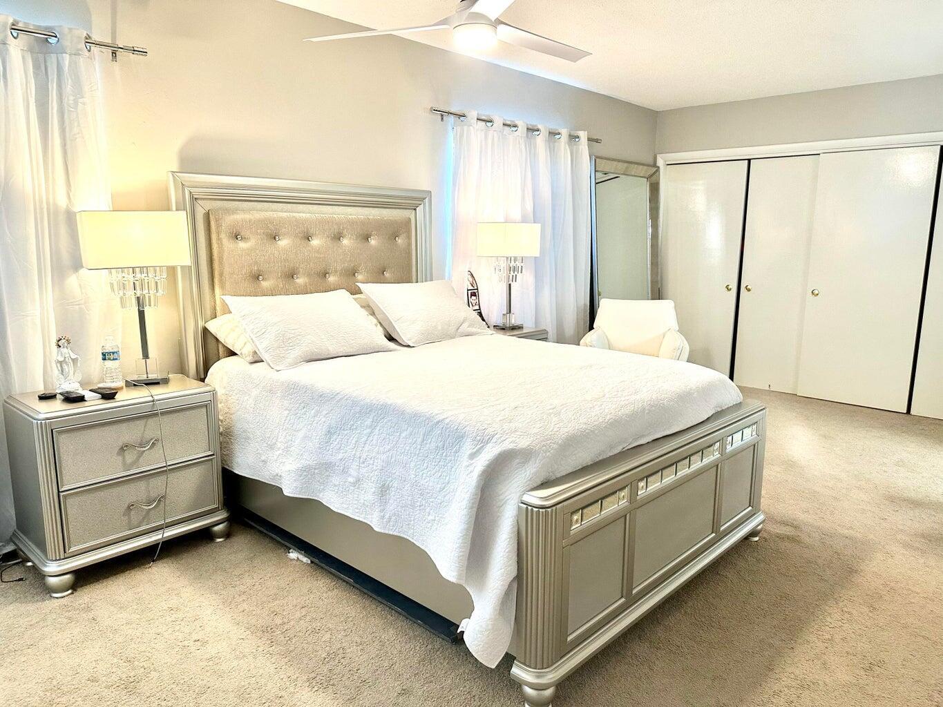 2735 Northeast 28th Court Lighthouse Point, FL 33064 - Photo 9 of 28 a bedroom with a bed and a window