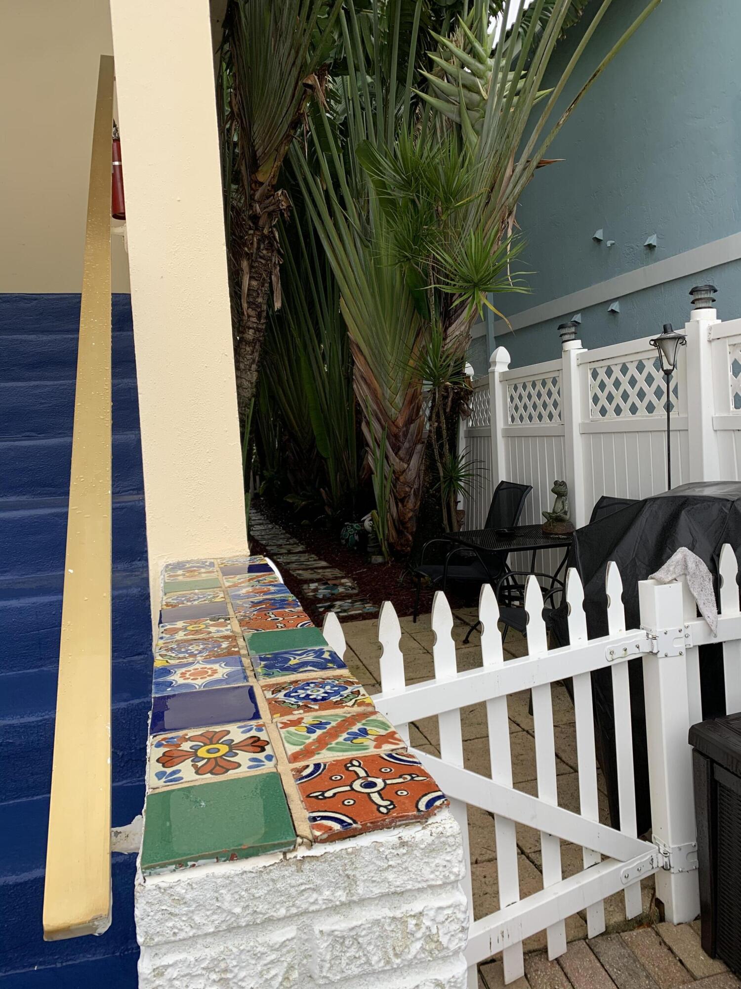 2735 Northeast 28th Court Lighthouse Point, FL 33064 - Photo 10 of 28 a view of an chairs and table on the house