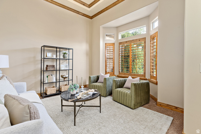 552 East Johns Way Sandy, UT 84070 - Photo 12 of 67 Tray ceiling with wood-finish accents, large bay window with wood-finish shutters, and light-toned wall paint