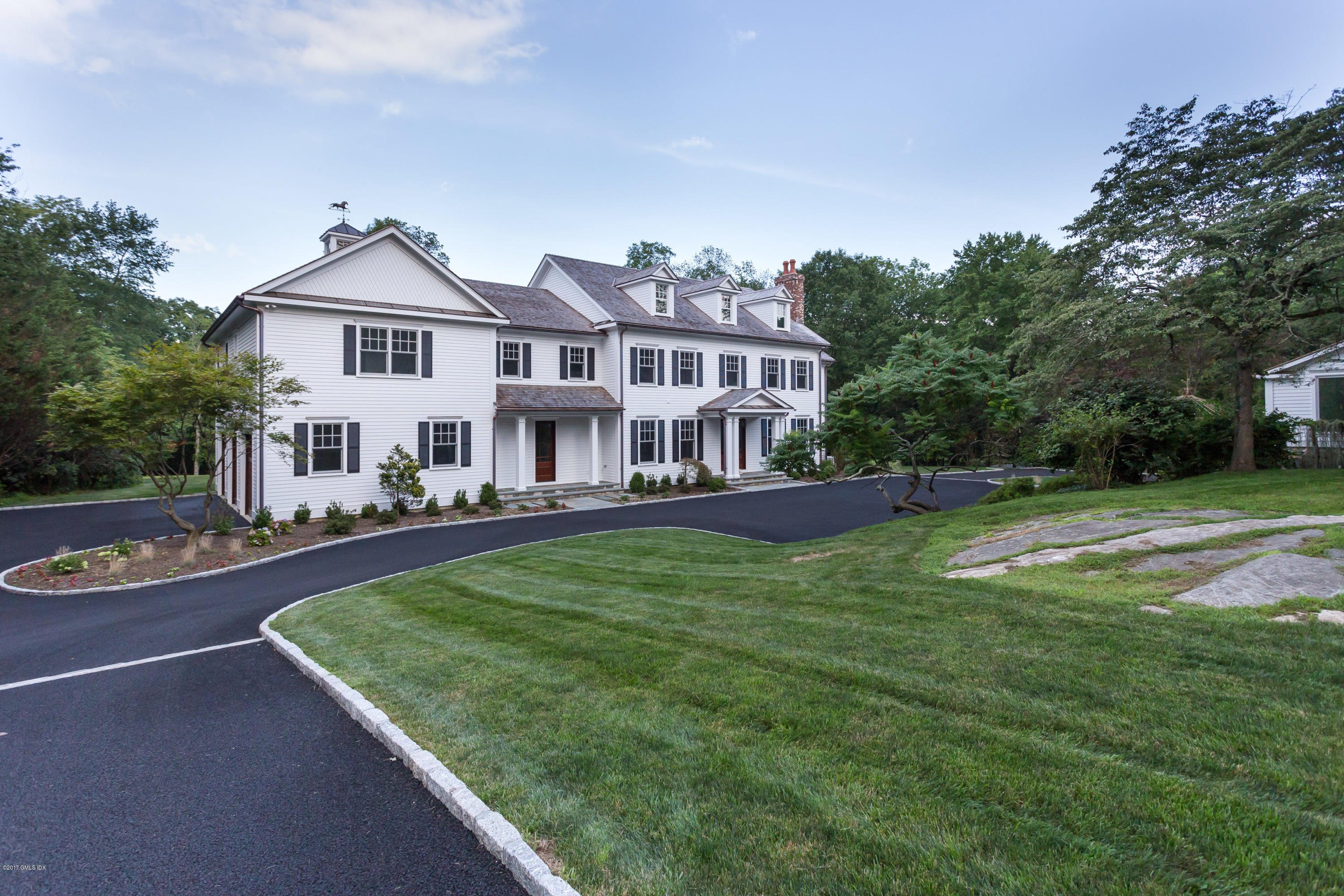 a view of a house with a yard porch and sitting area