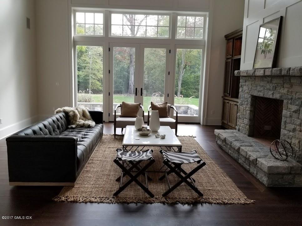 171 Cognewaugh Road Cos Cob, CT 06807 - Photo 14 of 31 a living room with furniture and a fireplace