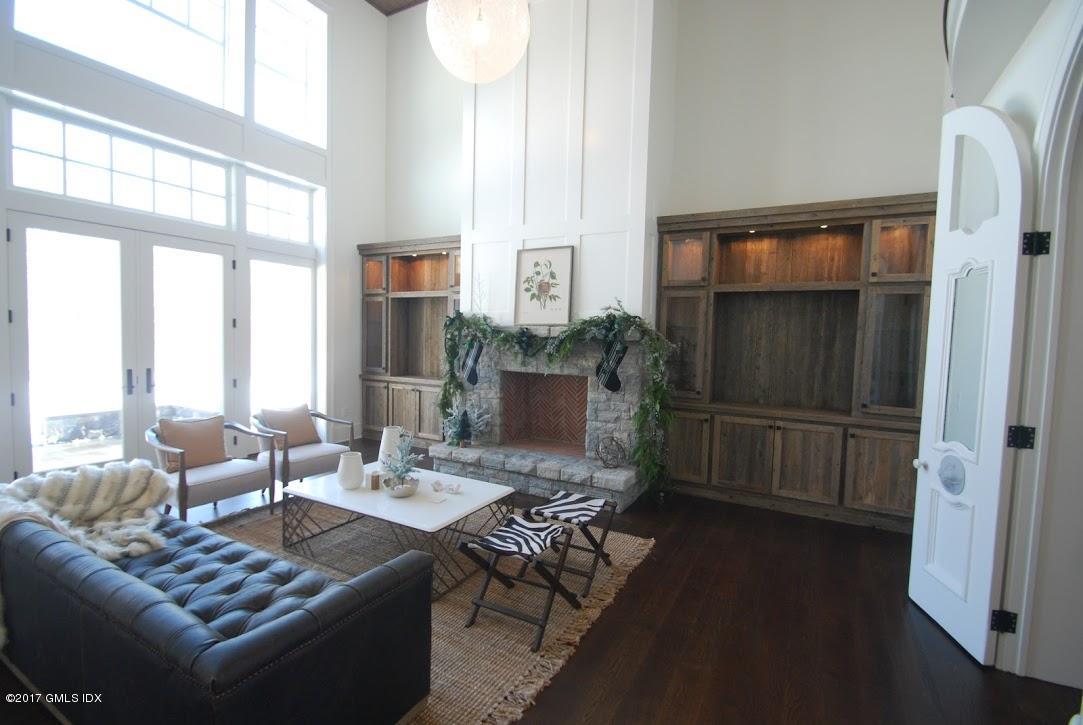 171 Cognewaugh Road Cos Cob, CT 06807 - Photo 15 of 31 a living room with furniture and a window