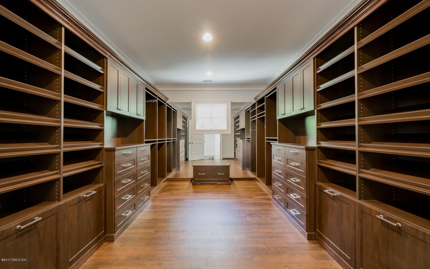 171 Cognewaugh Road Cos Cob, CT 06807 - Photo 20 of 31 a view of walk in closet and wooden floor