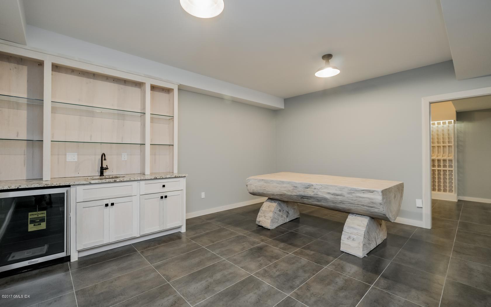 171 Cognewaugh Road Cos Cob, CT 06807 - Photo 25 of 31 a room with granite countertop furniture a rug and a window