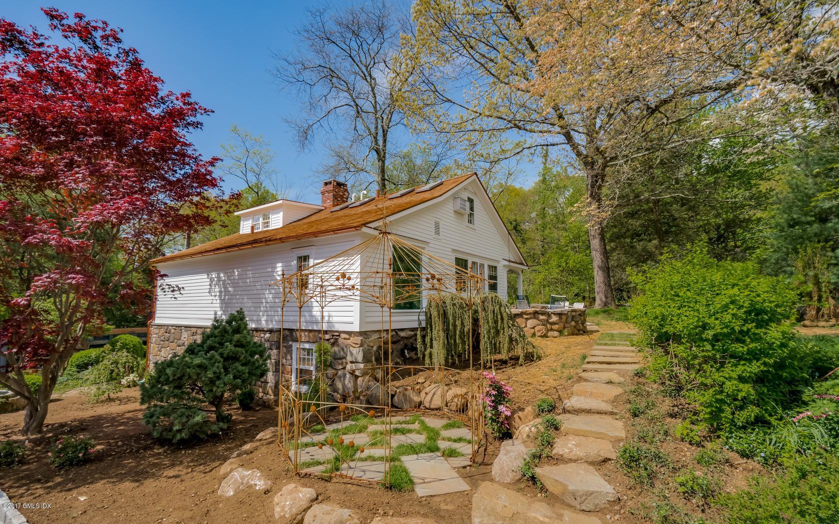 171 Cognewaugh Road Cos Cob, CT 06807 - Photo 28 of 31 a view of a house with a yard