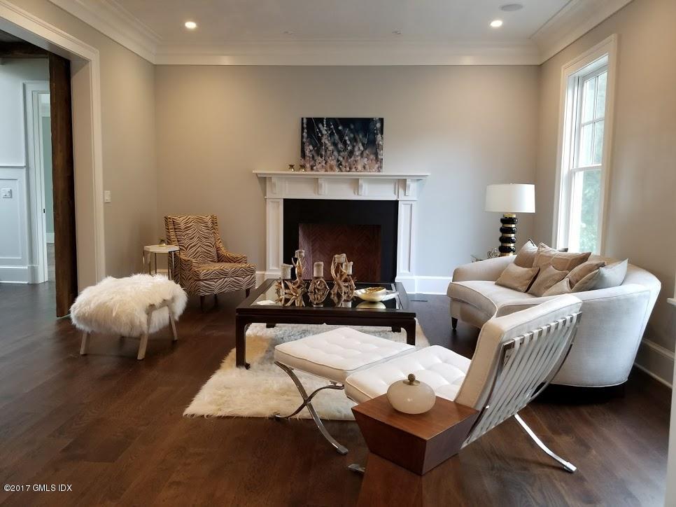 171 Cognewaugh Road Cos Cob, CT 06807 - Photo 5 of 31 a living room with furniture and a fireplace