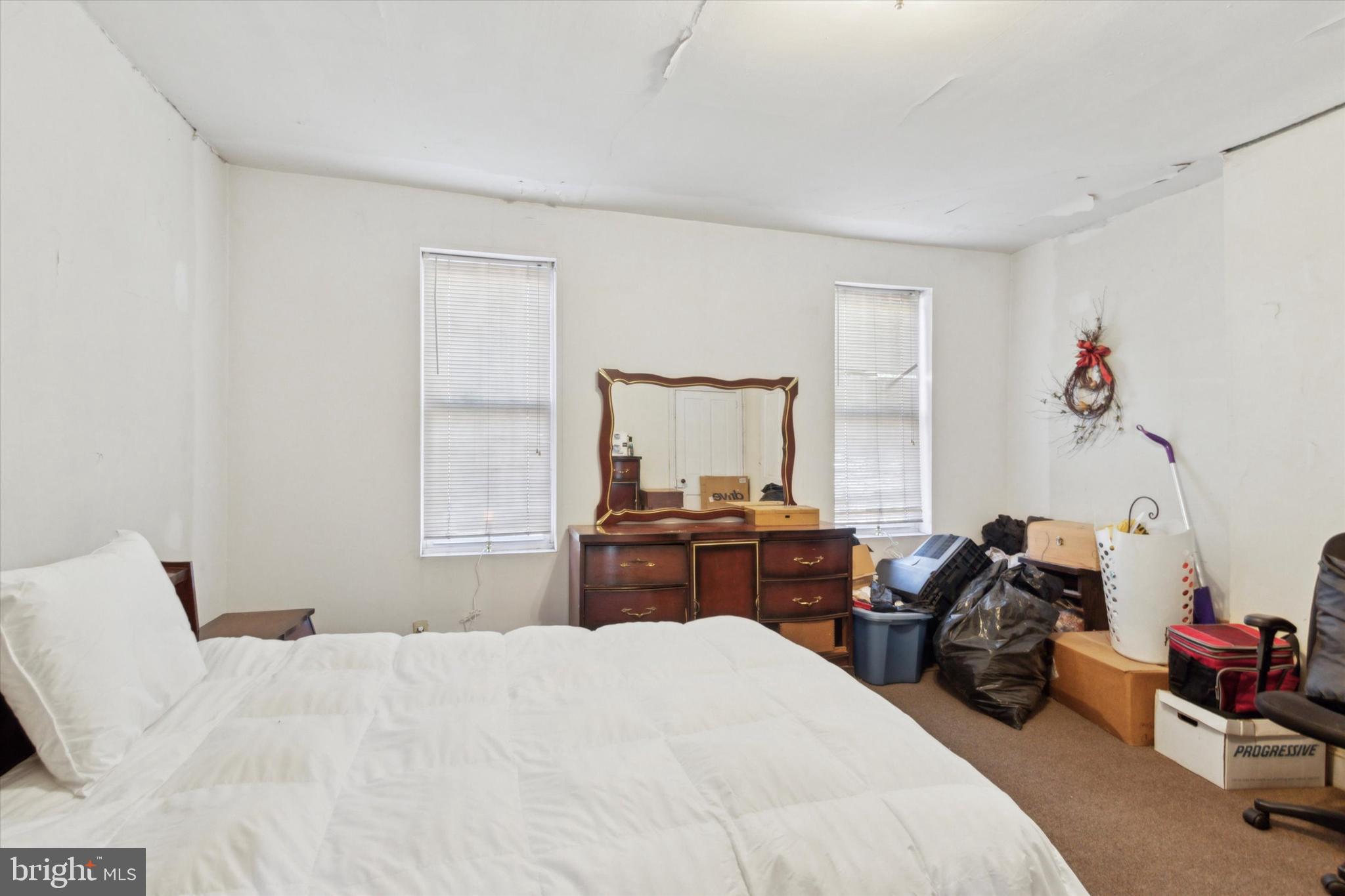 4800 Merion Avenue Philadelphia, PA 19131 - Photo 13 of 15 a bedroom with a bed and wooden floor