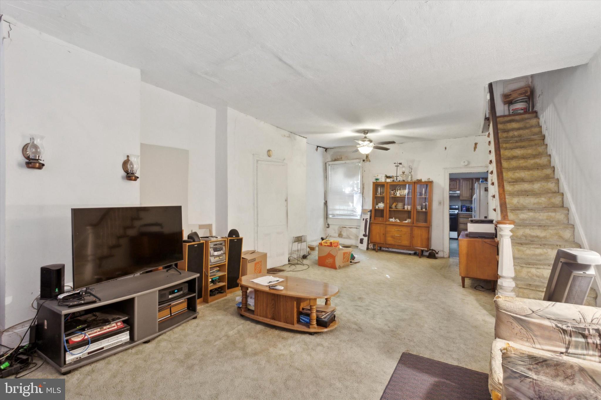 4800 Merion Avenue Philadelphia, PA 19131 - Photo 5 of 15 a living room with furniture and a flat screen tv