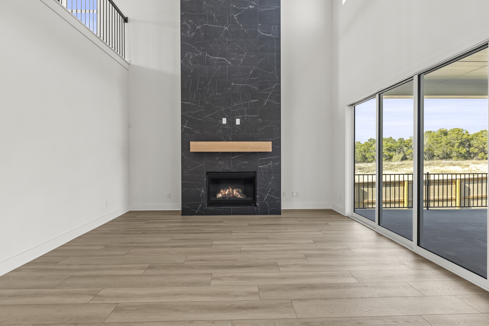 783 Iron Willow Loop Dripping Springs, TX 78620 - Photo 15 of 28 a view of an empty room with glass door
