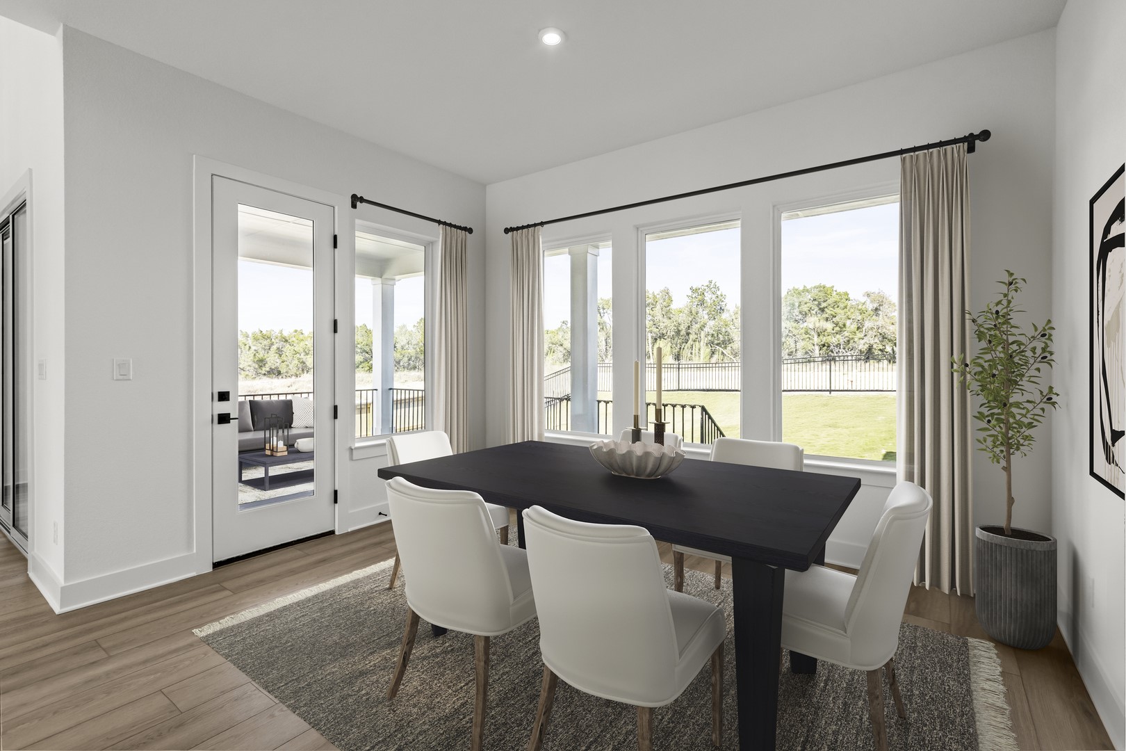 783 Iron Willow Loop Dripping Springs, TX 78620 - Photo 16 of 28 a dining room with furniture and wooden floor