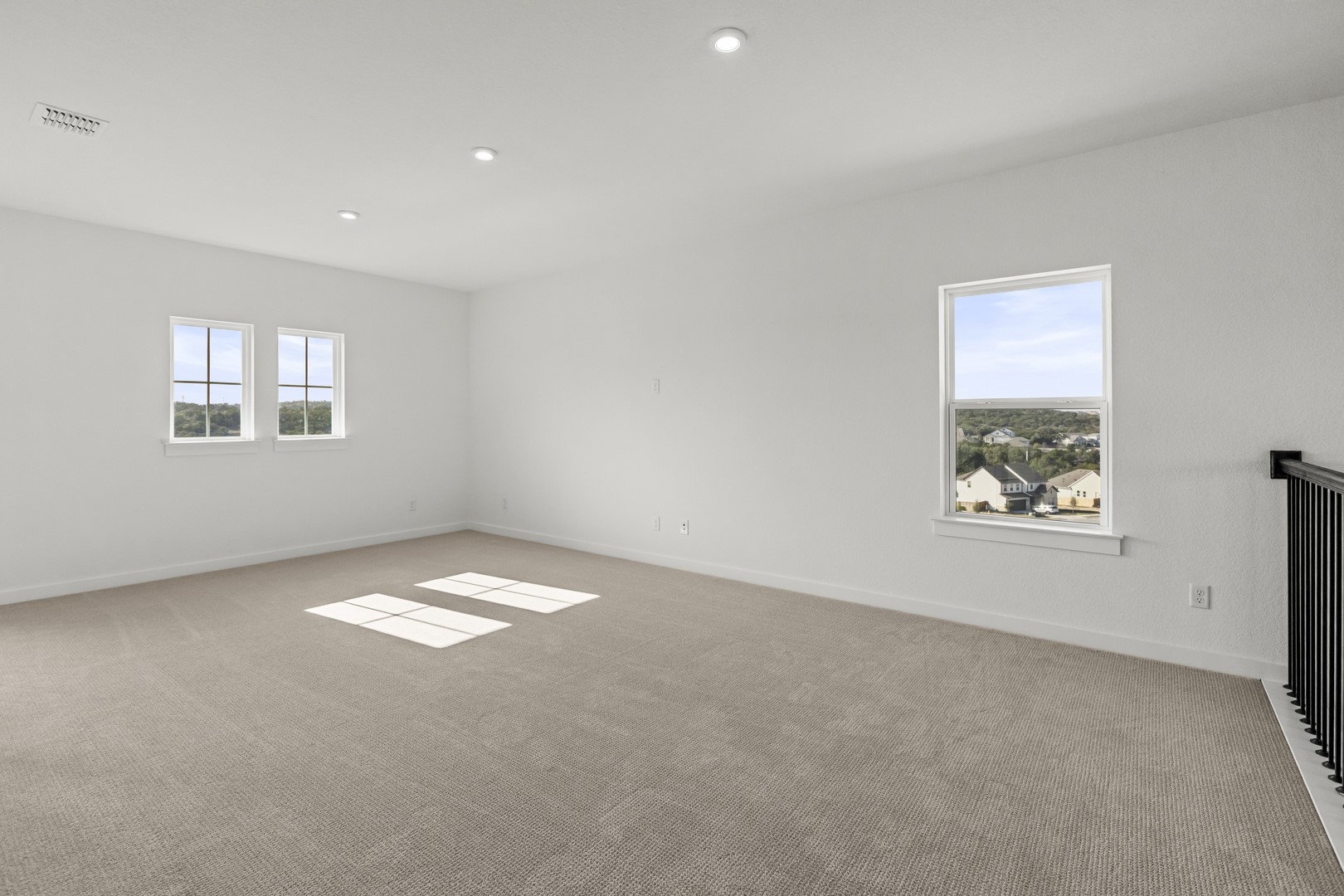 783 Iron Willow Loop Dripping Springs, TX 78620 - Photo 19 of 28 a view of an empty room and a window
