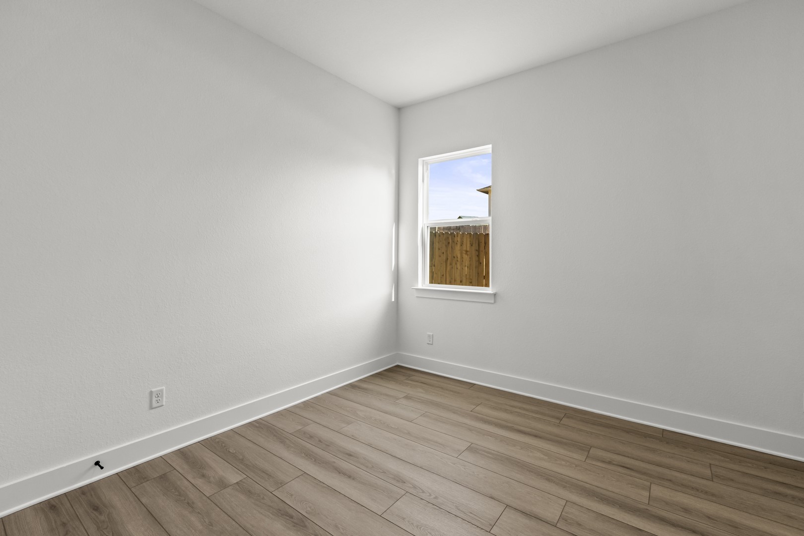 783 Iron Willow Loop Dripping Springs, TX 78620 - Photo 20 of 28 wooden floor in an empty room