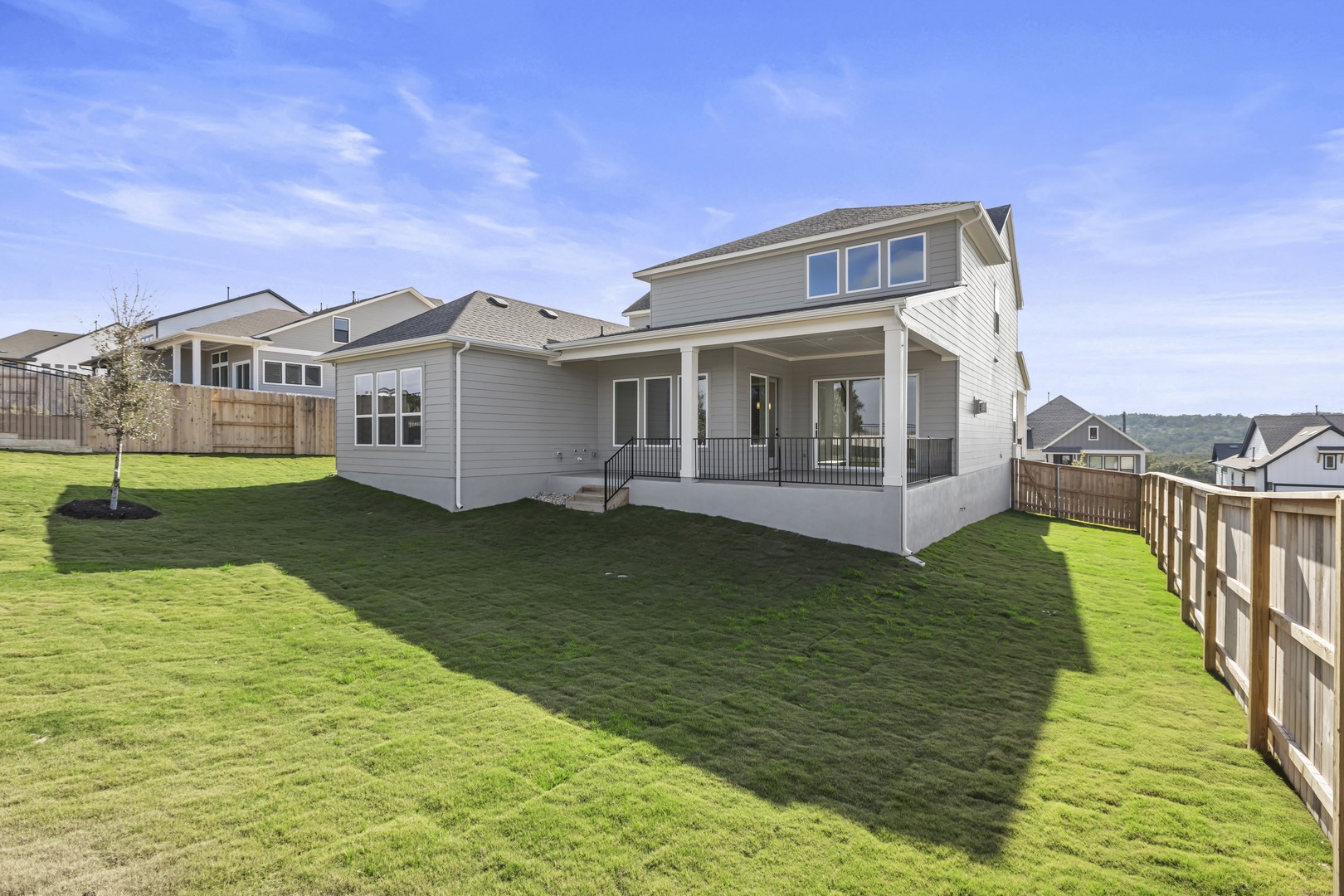 783 Iron Willow Loop Dripping Springs, TX 78620 - Photo 28 of 28 a front view of a house with garden