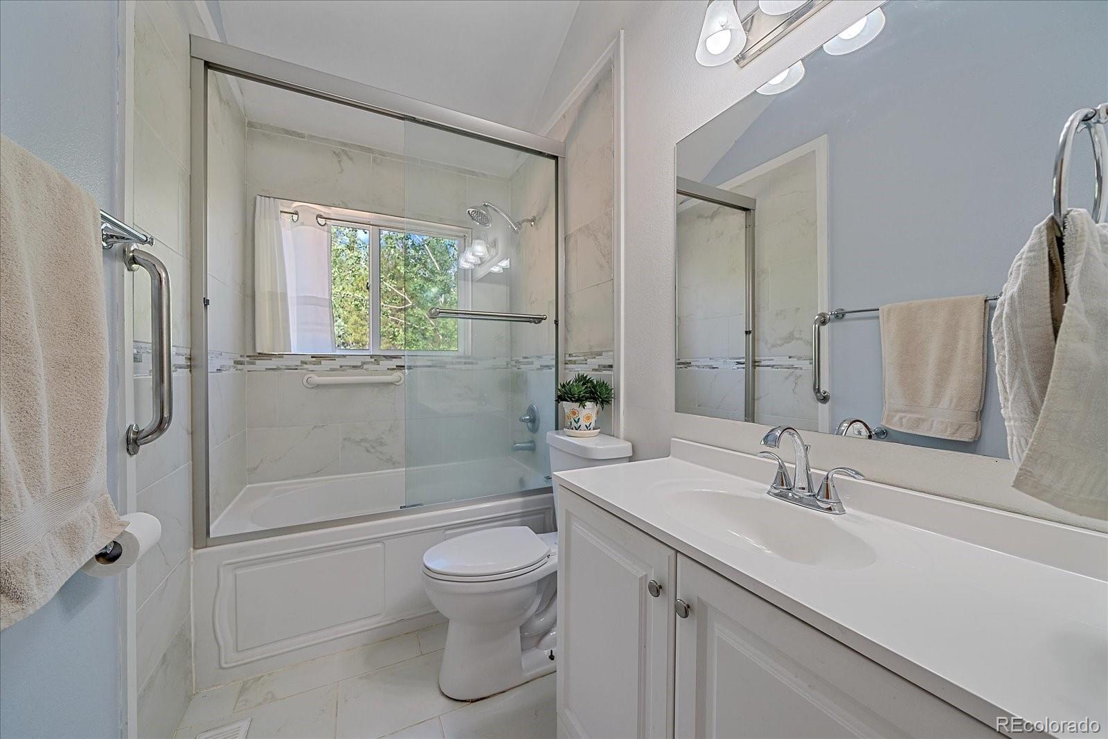 153 Wise Road Bailey, CO 80421 - Photo 16 of 38 a bathroom with a sink a toilet and shower