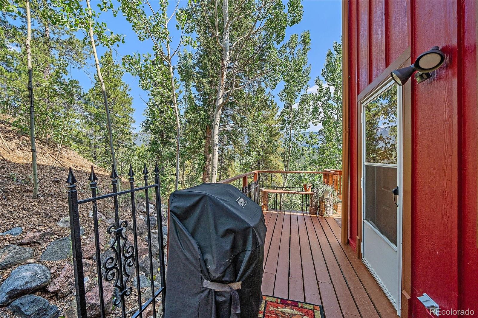 153 Wise Road Bailey, CO 80421 - Photo 29 of 38 a view of balcony with furniture and wooden deck